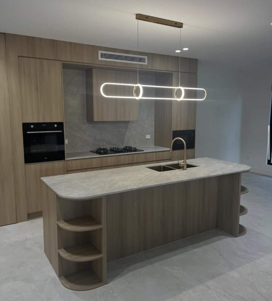 Luxury duplex kitchen with timber joinery and stone island, all internal joints caulked by Sunshine Silicone Solutions in Sydney